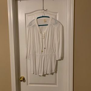 White shirt, gold accessories